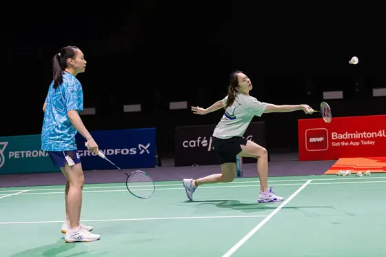 Badminton doubles action
