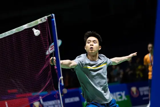 Badminton player at the net